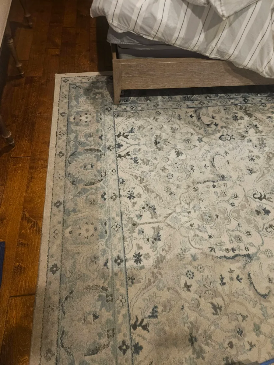 Bedroom area rug refreshed on hardwood floors, by Elite Carpet Cleaning in Summerville, SC